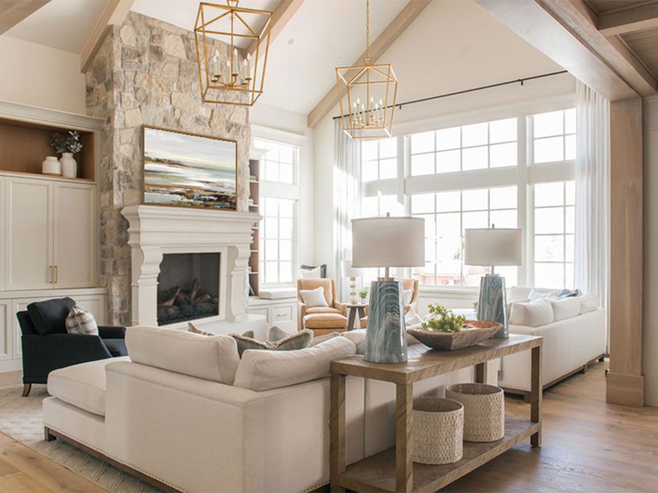 A white living room with a stone fireplace and wooden beams, perfect for enhancing SEO keywords and impressing Francesca.