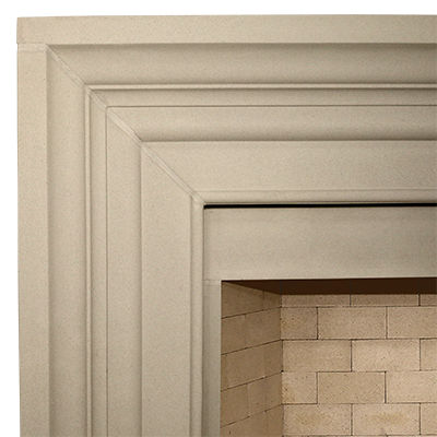 A transitional close up of a fireplace with a brick surround.
