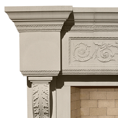 An ornate French fireplace mantel with carvings on it.