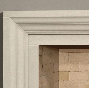 A white fireplace mantel with a brick surround featuring FF ELLIE.
