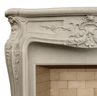 A French ornate fireplace mantle with elaborate carvings.