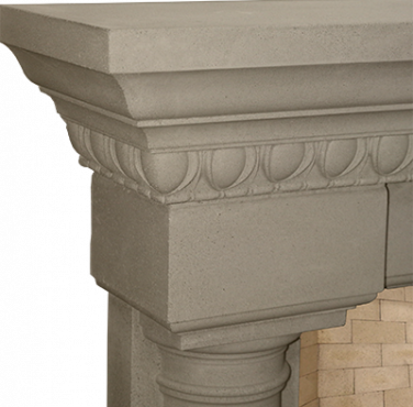 An Italian stone fireplace mantle with a brick surround.