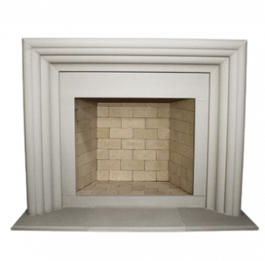 A fast fireplace with a white brick surround.